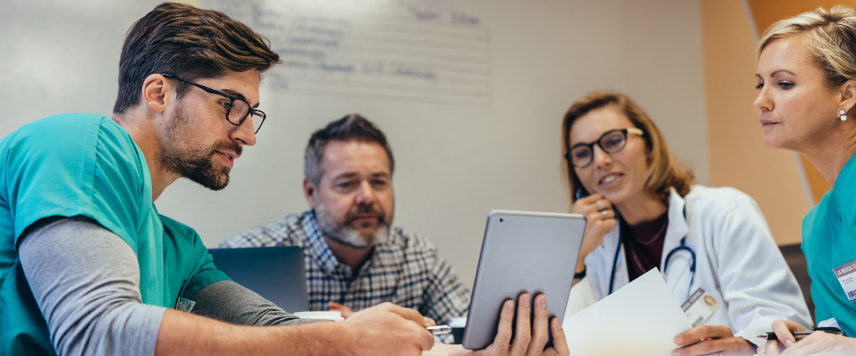 Healthcare professionals sitting inside office