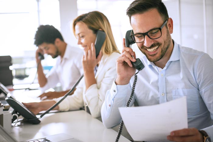 Team of IT specialists on the phone